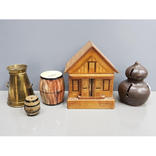41 - A COLLECTION OF 5 MONEY BOXES TO INCLUDE A BRASS MILK CHURN,  A WOODEN CHALET WITH KEY, A STUDIO POT... 