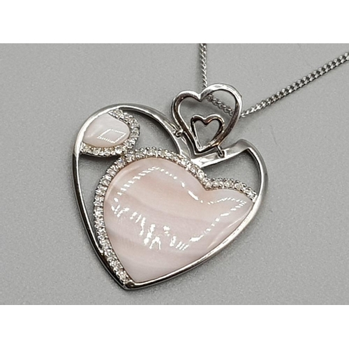 Ladies 9ct white gold pink stone & diamond heart pendant with chain, featuring a white gold heart set with 2 pink stones, the smaller stone set with 9 diamonds, and the bigger heart set with 25 diamonds, complete with 9ct white gold chain, 8.2g
