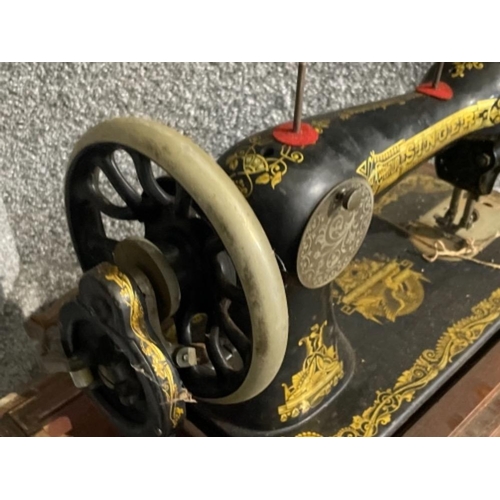 33 - Antique cased singer sewing machine