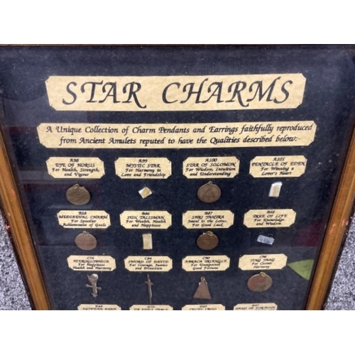 35 - Framed collection of Star charms (all present)