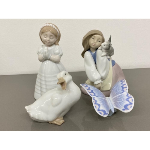 14 - 4x Nao by Lladro figures includes 1466 bunny’s best friend, 1553 my first communion, 1464 Gentle lav... 