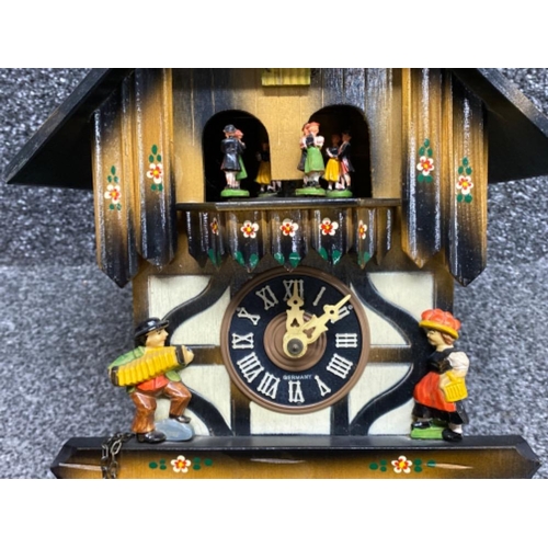 21 - Wicker twin handled basket containing a vintage German hand-painted novelty cuckoo clock, with origi... 