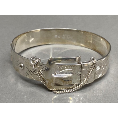 24 - 1970s hallmarked silver bangle in the form of a belt buckle, 24.1g