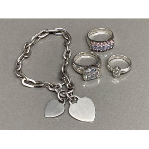 27 - 3 silver dress rings & tested silver twin heart Bracelet