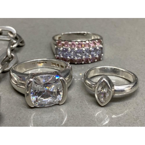 27 - 3 silver dress rings & tested silver twin heart Bracelet