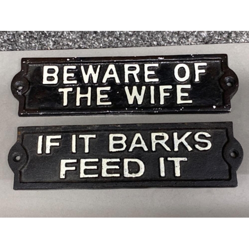 38 - 2 cast metal signs - “if it barks feed it” & “beware of the wife”