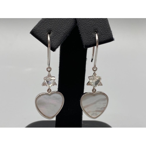 37 - 18ct White Gold Mother of Pear Heart Shaped Earrings Comprising of 0.7cts total of diamonds mounted ... 