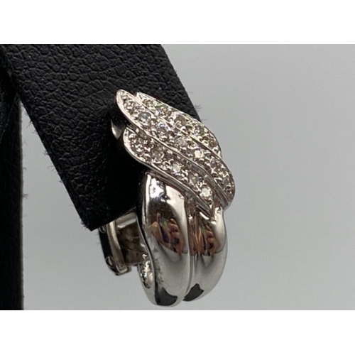 39 - 18ct White Gold Fancy Cuff style earrings comprising of 0.30cts of diamonds weighing 7.37 grams