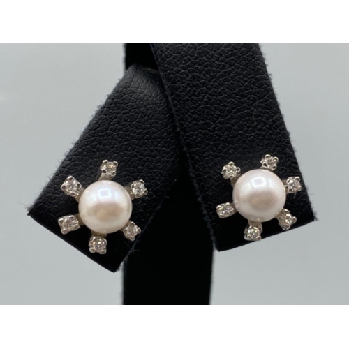 57 - Beautiful Pearl Studs each surrounded by 6 small diamonds - 0.10cts total weighing 4.36 grams