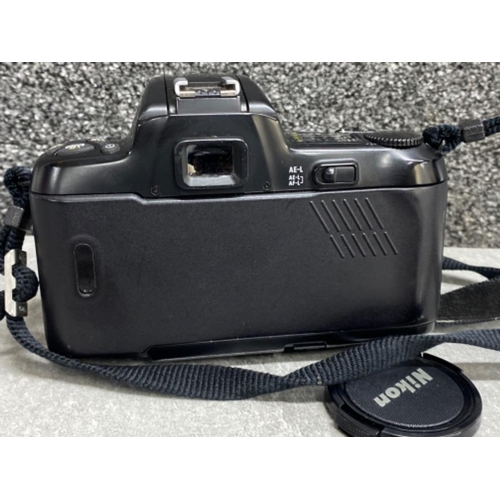 28 - Nikon F-601 camera with Hoya 52mm skylight lens