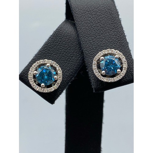 54 - 18ct White Gold Earrings comprising of a 1.40ct fancy coloured diamond center stone with 0.22ct tota... 