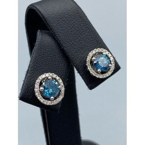 54 - 18ct White Gold Earrings comprising of a 1.40ct fancy coloured diamond center stone with 0.22ct tota... 