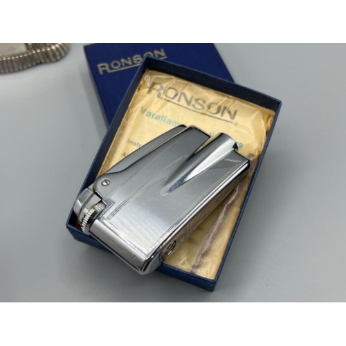 12 - Ronson lighters including Diana 1950s table lighter, working Varaflame 1960s lighter in original box... 
