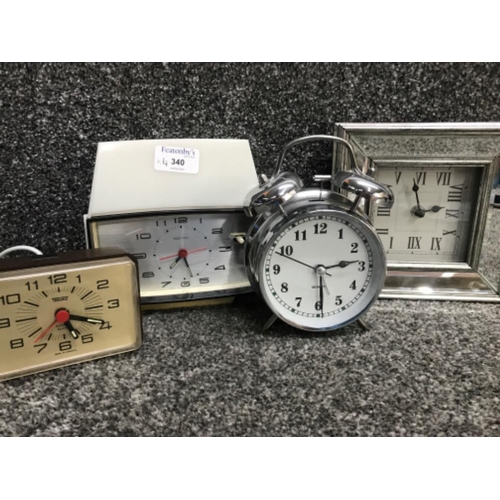 A vintage metamec alarm clock, vintage trenkle clock plus 2 modern clocks
