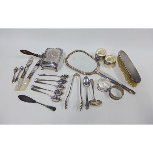 38 - Mixed lot with silver napkin rings, silver backed hand mirror and clothes brush and various silver a...