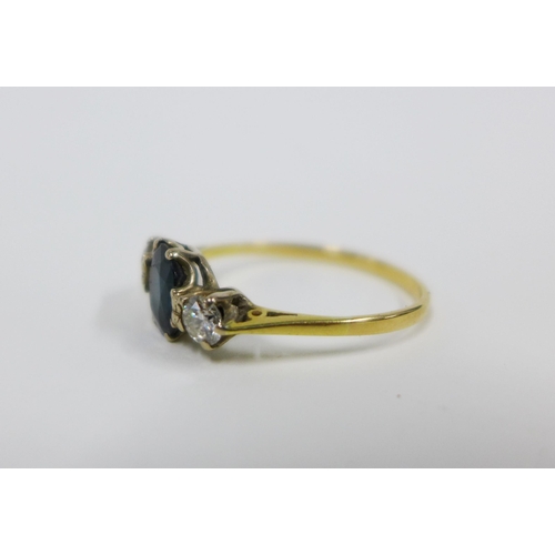 71 - Sapphire and diamond three stone ring, with a central oval sapphire flanked by bright cut diamonds, ... 