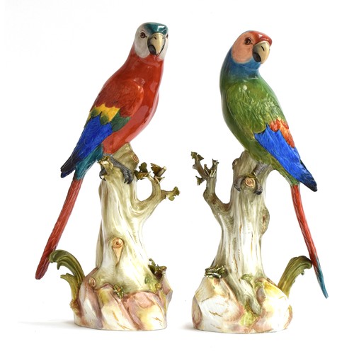 A pair of late 19th century Meissen parrots with colourful plumage perched upon tree stumps, first modelled by J.J. Kaendler, each with blue crossed swords to base and incised No. 63, 32.5cm high and 33cm high

Provenance: From the estate of John Manners-Sutton, 3rd Baron Manners (1852-1927) late of Avon Tyrrell House, Sopley, Hampshire and thence by descent through the family