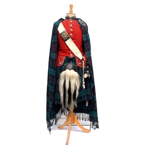 A British dress uniform of the 105 Glasgow Highlanders, including scarlet red tunic, woollen tartan pleated kilt, sporran, etc, together with a photograph of the regiment, etc