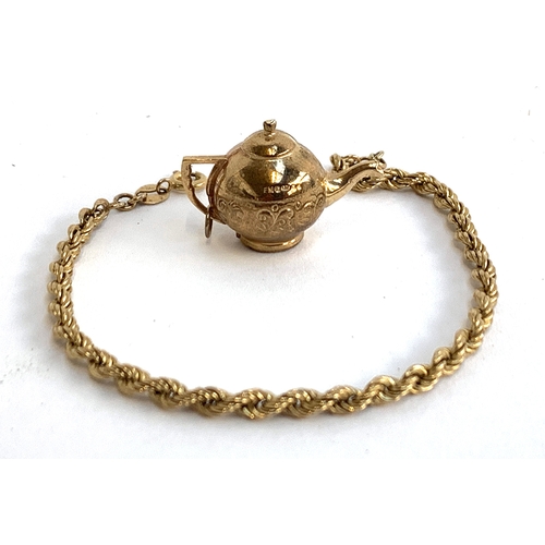 2 - A 9ct gold ropetwist bracelet, 18.5cmL, approx. 1.8g; together with a 9ct gold teapot charm, approx.... 