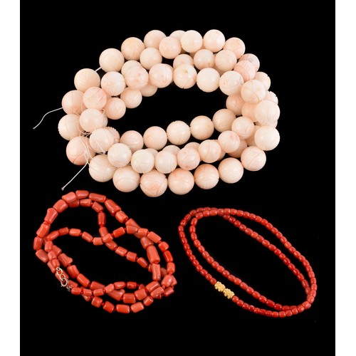 22 - A coral bead necklace, the graduated circular coral beads with carved decoration measuring 1.7cm to ... 
