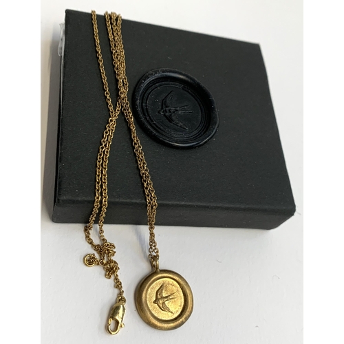 32 - An Effra 925 'Home' pendant in the form of a wax seal, matte gold finish, chain 58cmL, 8.1g, boxed