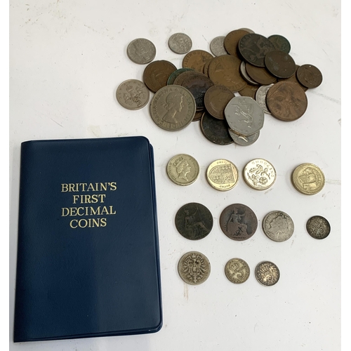 56 - A collection of British and foreign coins to include 10 pfennig 1875, 3 pence coin 1919, 1922 (2), h... 