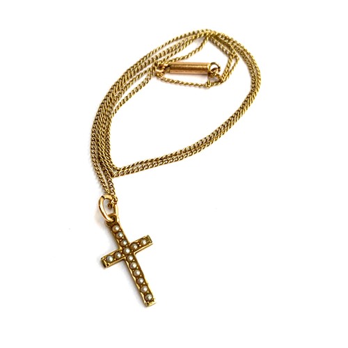 5 - A 14ct gold crucifix set with seed pearls, on a chain marked 10ct with barrel clasp, 40cmL, approx. ... 