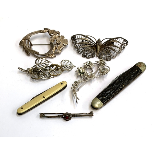 15 - A mixed lot to include white metal Czech filigree butterfly; Czech leaf brooch; Art Nouveau hallmark... 