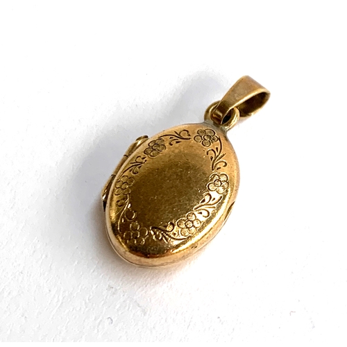 16 - A 9ct gold locket with engraved floral design, approx. 3.6g