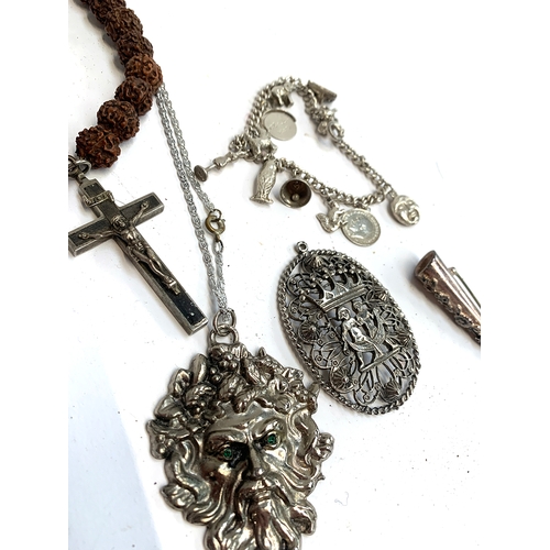 47 - A small lot of white metal items to include a rosary; pierced pendant depicting two nude figures ben... 