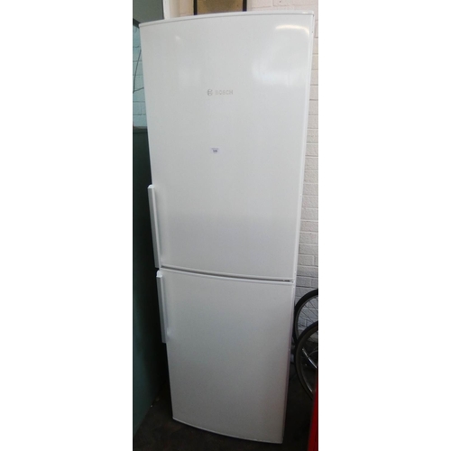 A tall (approx 6') Bosch half and half fridge freezer Barnebys