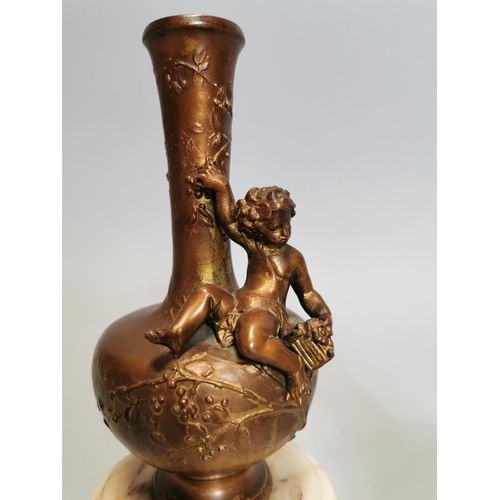 53 - Pair of spelter and marble vases decorated with foliage and a seated cherub { 21cm H X 10cm Dia. }