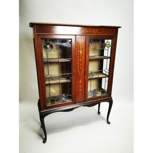 21 - Edwardian inlaid mahogany display cabinet the two glazed doors with coloured leaded glass inserts, r... 