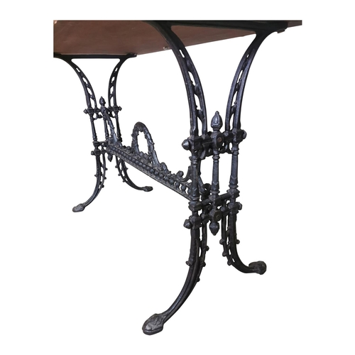 30 - Decorative Cafe table the wooden top raised on cast iron base {72cm H x 100cm W x 52cm D}
