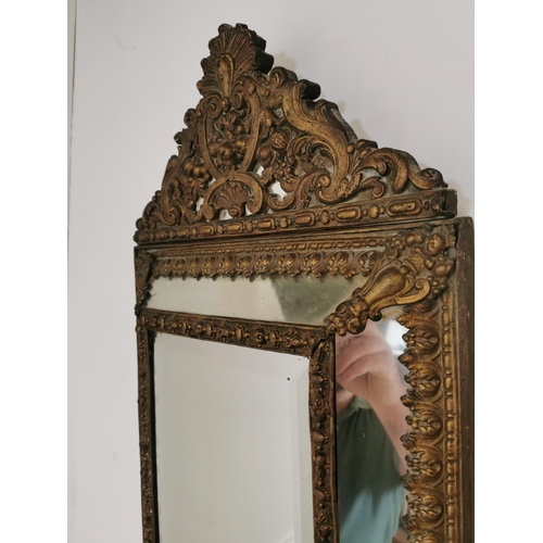 13 - 19th C. embossed brass cushion mirror {70 cm H x 43 cm W}.