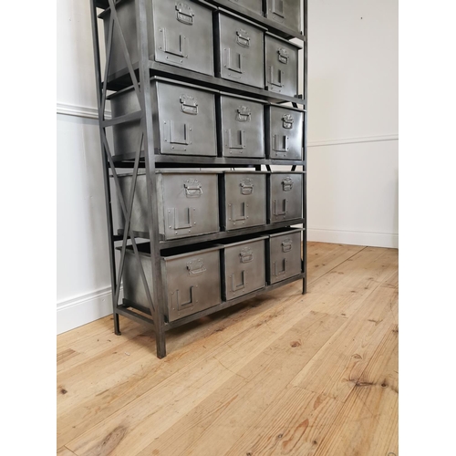 16 - Bank of fifteen metal storage drawers in the industrial style {169 cm H x 100 cm W x 35 cm D}.
