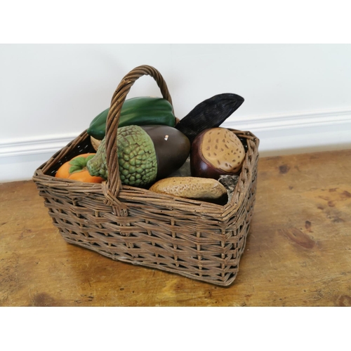 26 - Collection of early 20th C. ceramic shop display vegetables and nuts in wicker basket {32 cm H x 34 ... 
