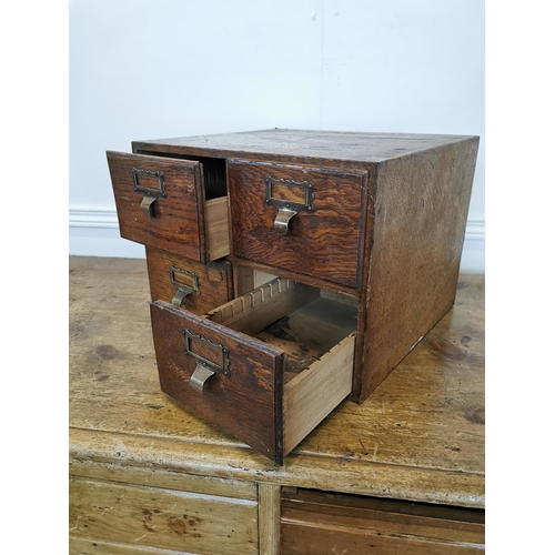 31 - Early 20th C. bank of oak office drawers {27 cm H x 38 cm W x 36 cm D}.