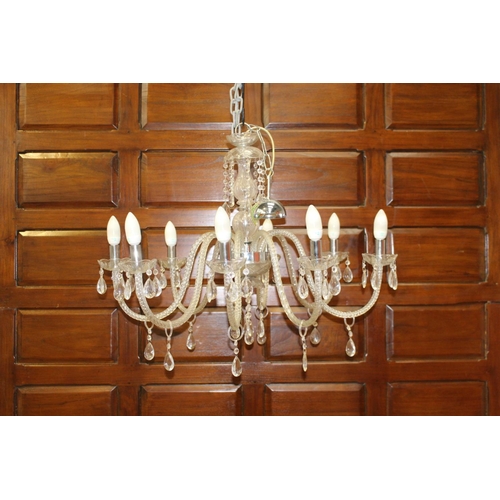 15 - Crystal eight branch chandelier with chrome centre {90 cm H x 80 cm Dia.}.