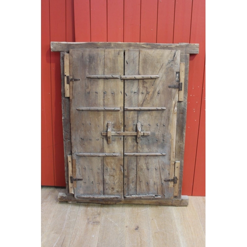19 - Pitch pine window frame with metal insert in the Moroccan style {128 cm H x 108cm W x 5 cm D}.