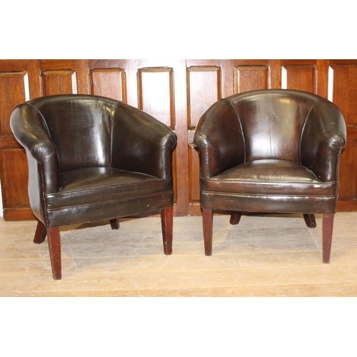 28 - Pair of dark brown leather upholstered tub chairs {78 cm H x 70 cm W x 47 cm D}.
