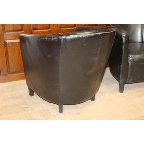 29 - Pair of black leather tub chairs {78 cm H x 70 cm W x 47 cm D}.