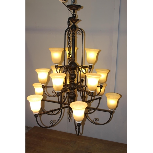 3 - Wrought iron fifteen branch chandelier with opaque shades {140 cm H x 114 cm Dia.}.