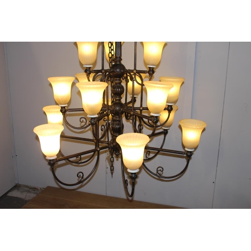 3 - Wrought iron fifteen branch chandelier with opaque shades {140 cm H x 114 cm Dia.}.