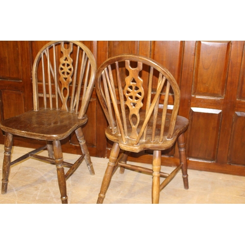 31 - Pair of oak Windsor kitchen chairs {88 cm H x 40 cm W x 40 cm D}.