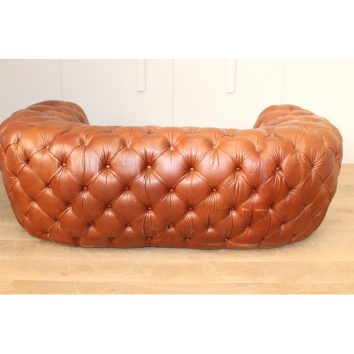 35 - Deep buttoned leather upholstered Chesterfield sofa {70 cm H x 200 cm W x 65 cm D}.