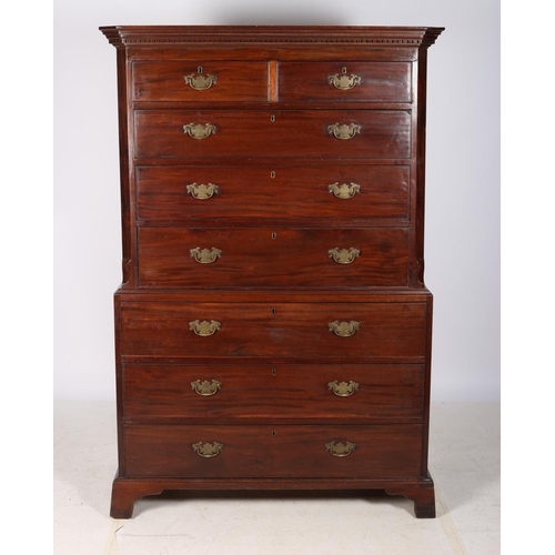 A FINE GEORGIAN MAHOGANY SECRETAIRE CHEST ON CHEST the dentil moulded cornice above two short and three long graduated drawers between canted angles the base with three long graduated drawers and brass drop handles on bracket feet 182cm (h) x 121cm (w) x 56cm (d)