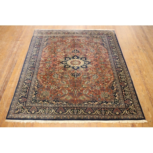 1 - A BIDJAR WOOL RUG the indigo and beige ground with central panel filled with stylized flowerheads an... 