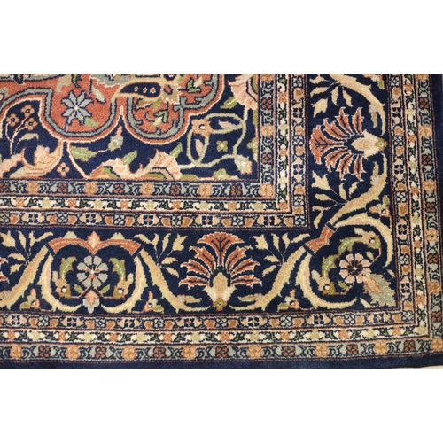 1 - A BIDJAR WOOL RUG the indigo and beige ground with central panel filled with stylized flowerheads an... 