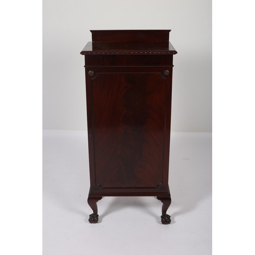 14 - A CHIPPENDALE DESIGN MAHOGANY MUSIC CABINET the rectangular top with gadrooned rim above a panelled ... 